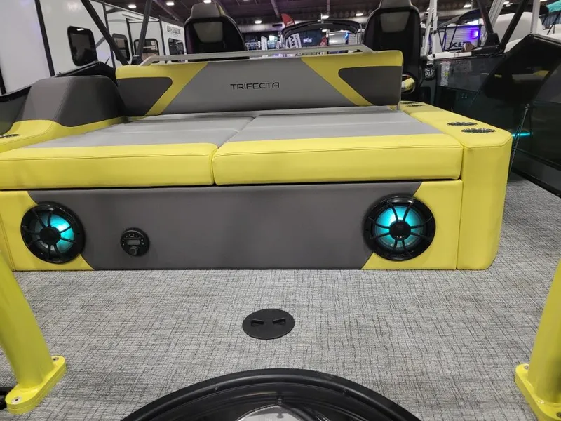 Slide: The Image of 2023 Trifecta 23 UL SS boat interior with yellow seating and illuminated speakers. - 13