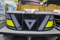 Slide: The Image of Trifecta 2023 23 UL SS pontoon boat with modern design and vibrant accents. - 19