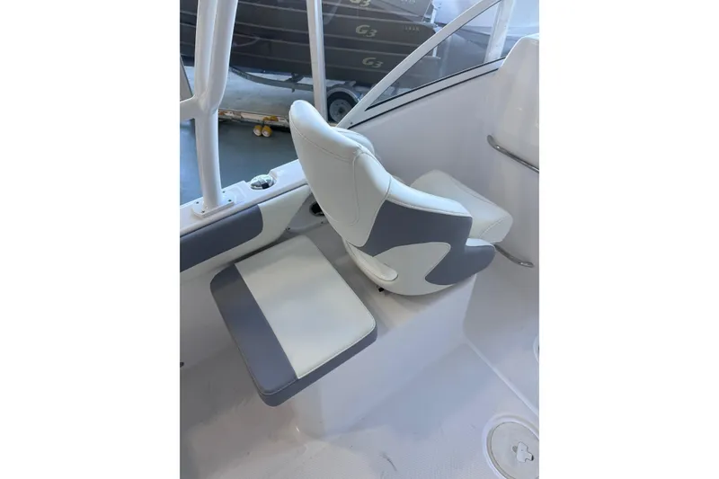 Slide: The Image of 2023 Release 230 DC boat interior with white and gray seating. - 4