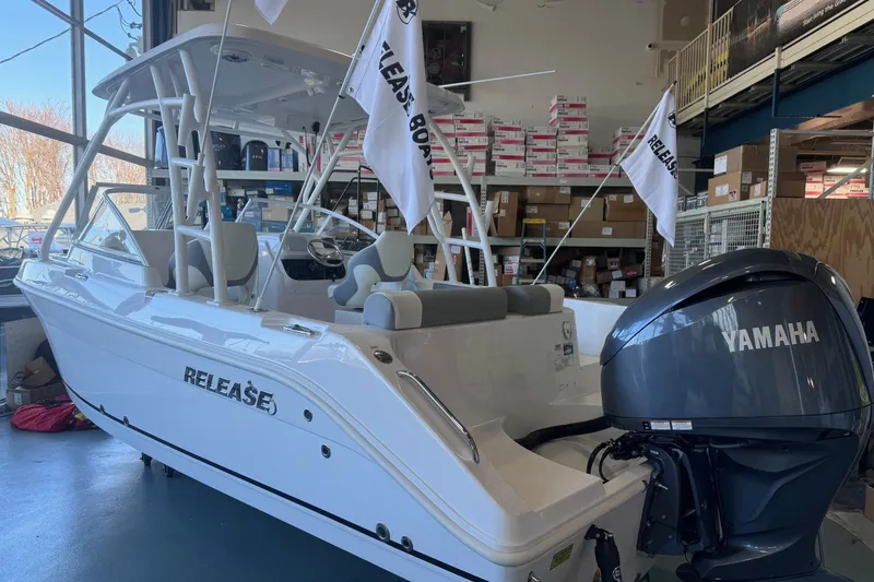 Slide: The Image of 2023 Release 230 DC boat with Yamaha engine in showroom. - 9