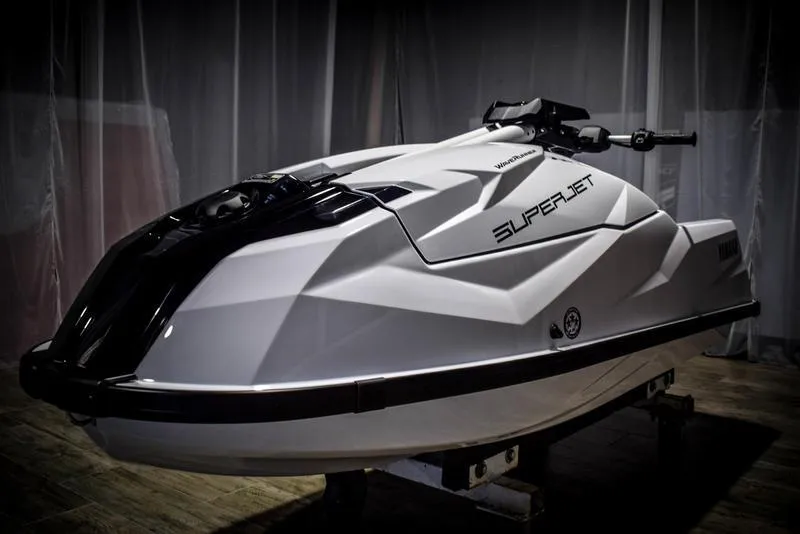 Slide: The Image of 2022 Yamaha WaveRunner SuperJet in a showroom, side view. - 3