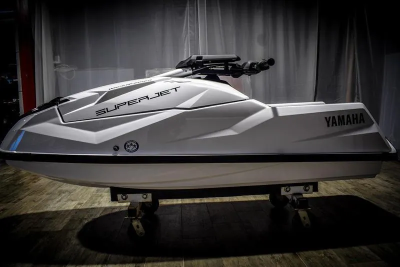 Slide: The Image of 2022 Yamaha WaveRunner SuperJet in white on display indoors. - 4