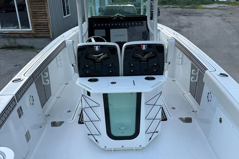 Slide: The Image of 2021 Wellcraft 262 Fisherman boat interior with dual seats and center console. - 10