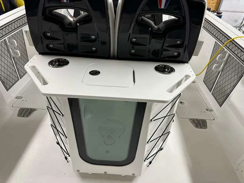 Slide: The Image of 2021 Wellcraft 262 Fisherman boat interior with seating and storage compartments. - 24