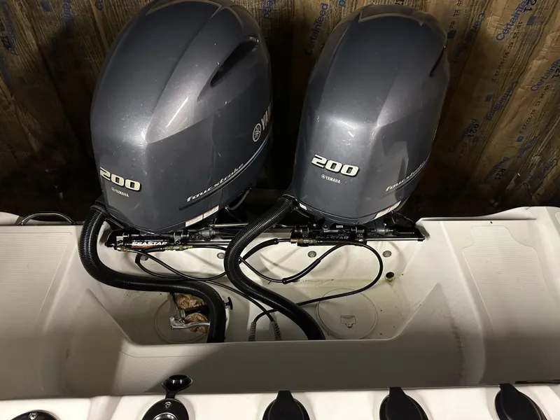 Slide: The Image of Twin Yamaha 200 engines on a 2021 Wellcraft 262 Fisherman boat. - 28
