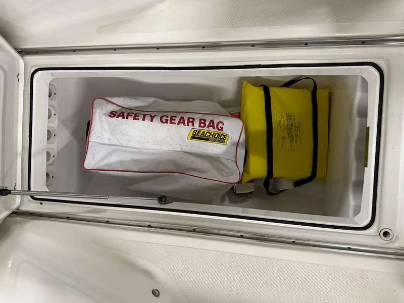 Slide: The Image of Safety gear bag in 2021 Wellcraft 262 Fisherman storage compartment. - 29