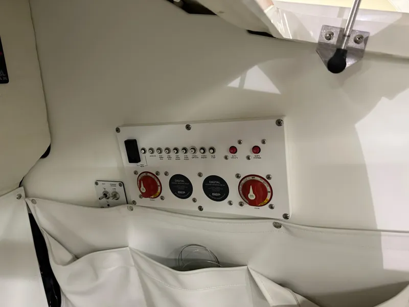 Slide: The Image of Control panel inside 2021 Wellcraft 262 Fisherman boat, featuring switches and dials. - 30