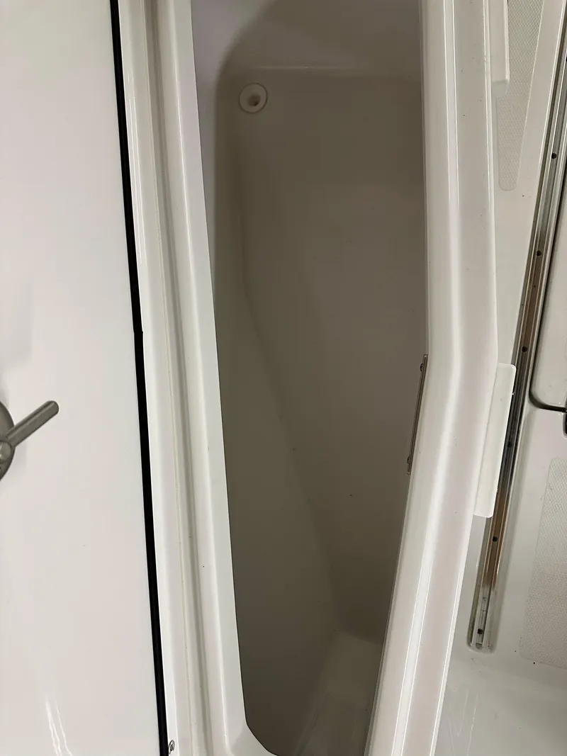 Slide: The Image of 2021 Wellcraft 262 Fisherman storage compartment interior view. - 33