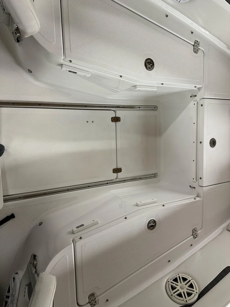 Slide: The Image of 2021 Wellcraft 262 Fisherman boat interior with storage compartments and sleek design. - 36