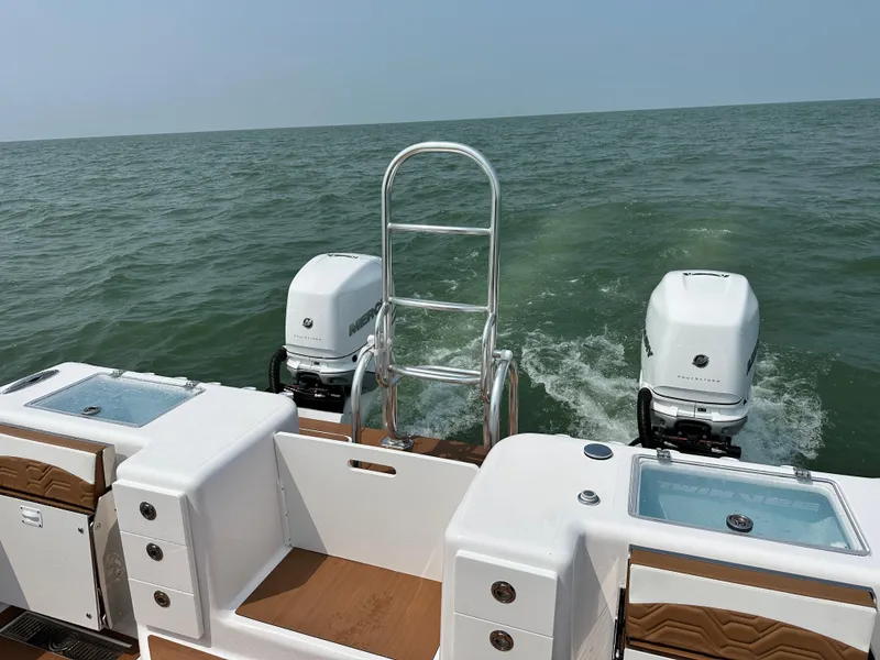 Slide: The Image of 2023 Twin Vee 340 GFX boat with dual engines on open water. - 22
