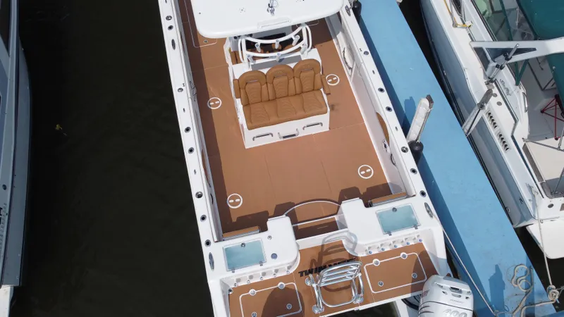 Slide: The Image of 2023 Twin Vee 340 GFX boat docked, aerial view of spacious deck and seating. - 25