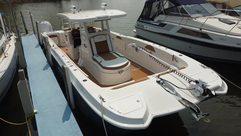 Slide: The Image of 2023 Twin Vee 340 GFX boat docked at marina. - 38