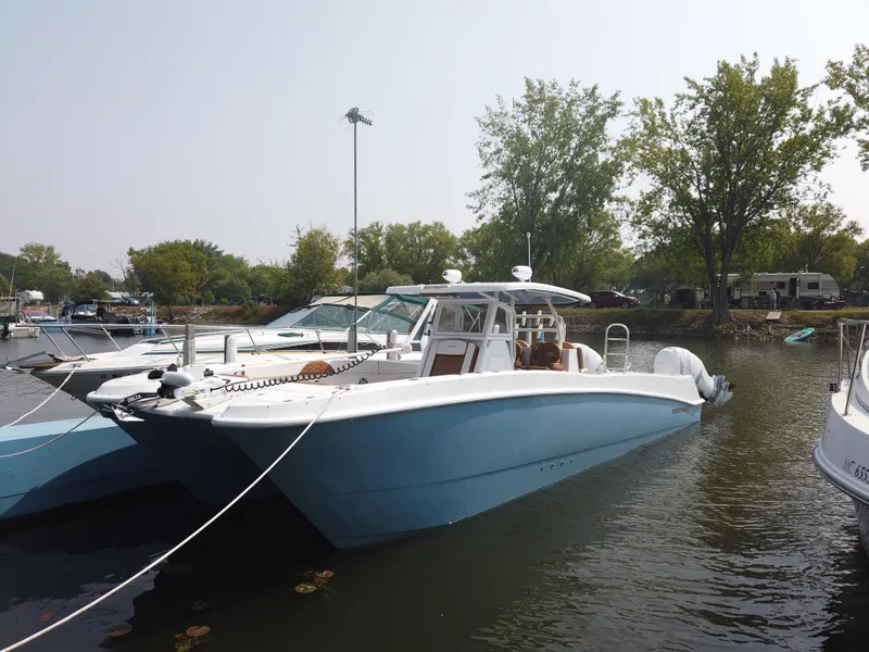 Slide: The Image of 2023 Twin Vee 340 GFX boat docked in a marina. - 41