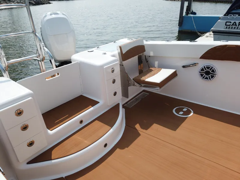 Slide: The Image of 2023 Twin Vee 340 GFX boat interior with seating and storage compartments. - 43