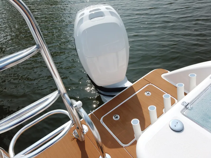 Slide: The Image of 2023 Twin Vee 340 GFX boat with outboard motor and fishing rod holders. - 46