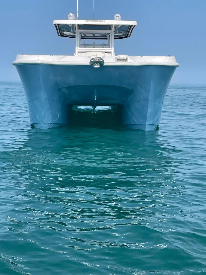 Slide: The Image of 2023 Twin Vee 340 GFX catamaran on open water. - 5