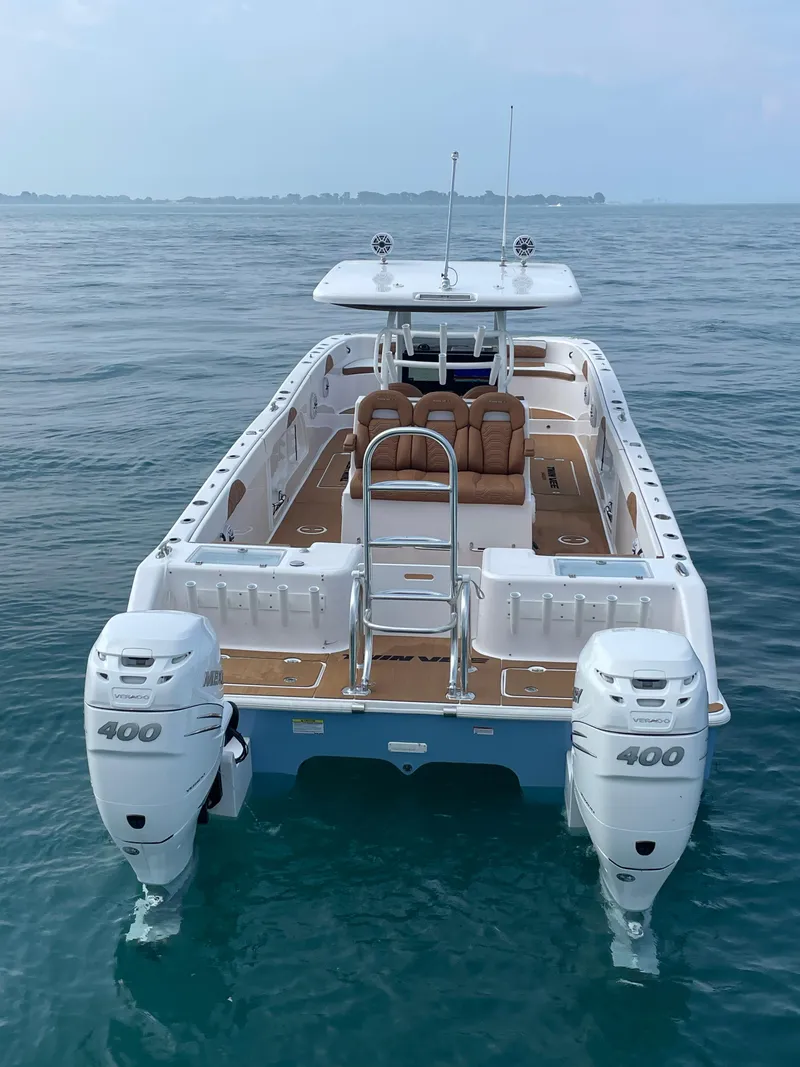 Slide: The Image of 2023 Twin Vee 340 GFX boat with dual 400 horsepower engines on open water. - 6