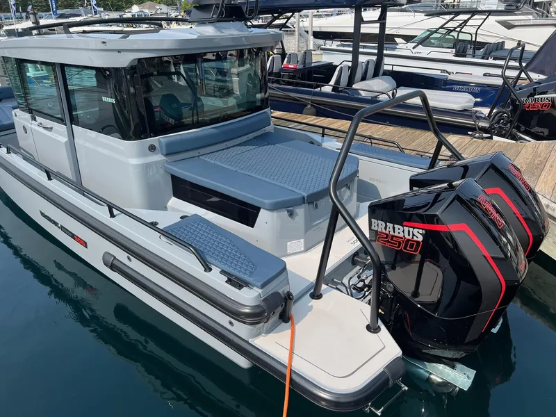 Slide: The Image of 2022 BRABUS Shadow 500 Cabin boat with twin BRABUS 250 engines docked at marina. - 10