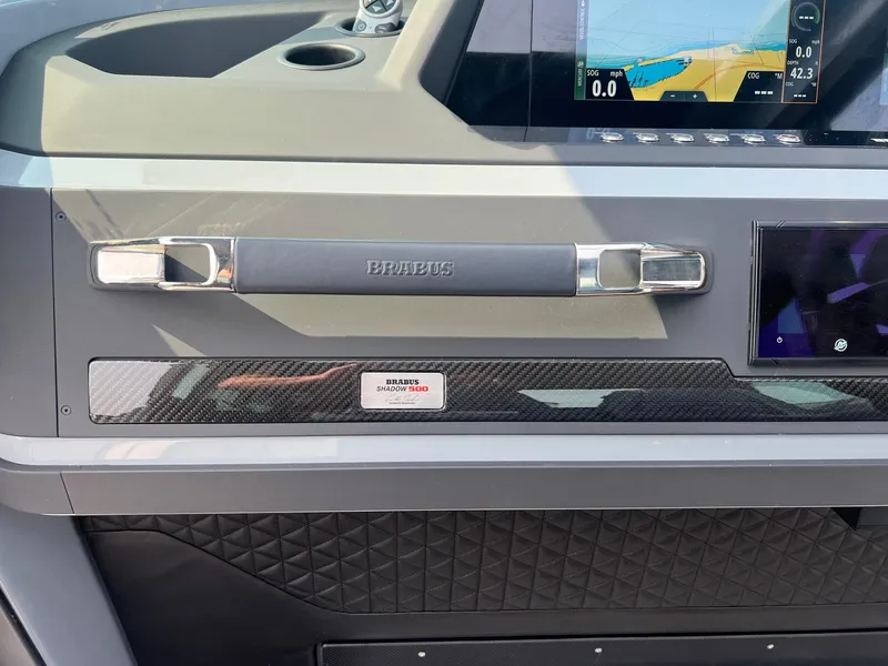 Slide: The Image of BRABUS Shadow 500 Cabin 2022 dashboard with carbon fiber accents and navigation display. - 18