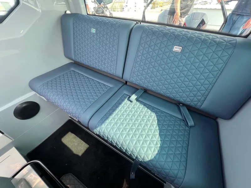 Slide: The Image of 2022 BRABUS Shadow 500 Cabin interior with quilted blue seating. - 21
