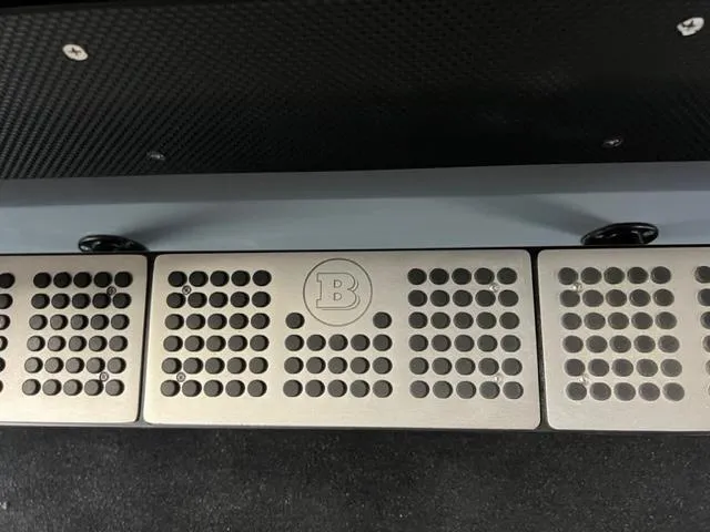 Slide: The Image of 2022 BRABUS Shadow 500 Cabin interior detail with branded metal footrest. - 28