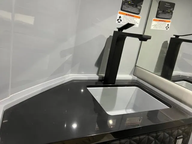 Slide: The Image of Modern sink in 2022 BRABUS Shadow 500 Cabin with sleek black countertop. - 40