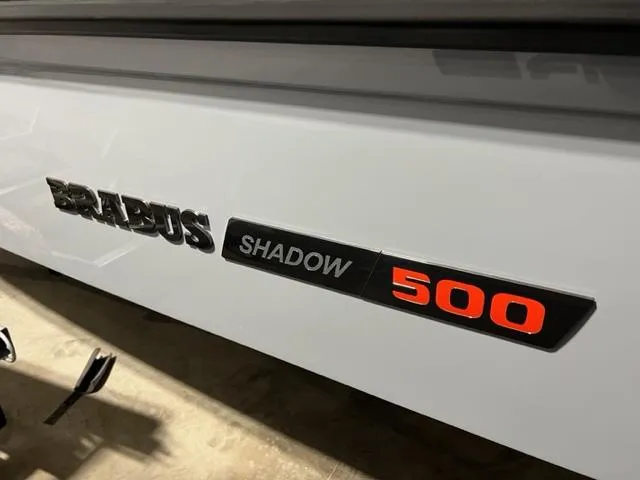 Slide: The Image of 2022 BRABUS Shadow 500 Cabin logo on sleek white surface. - 45