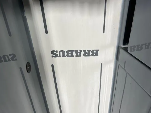 Slide: The Image of BRABUS Shadow 500 Cabin 2022 interior with logo on sleek paneling. - 46