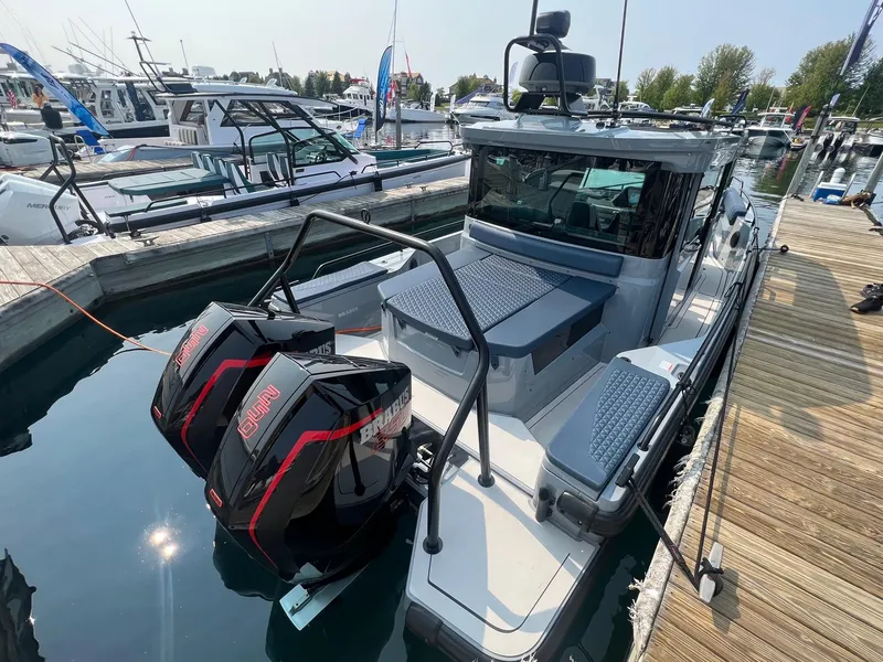 Slide: The Image of 2022 BRABUS Shadow 500 Cabin boat docked with dual outboard engines. - 9