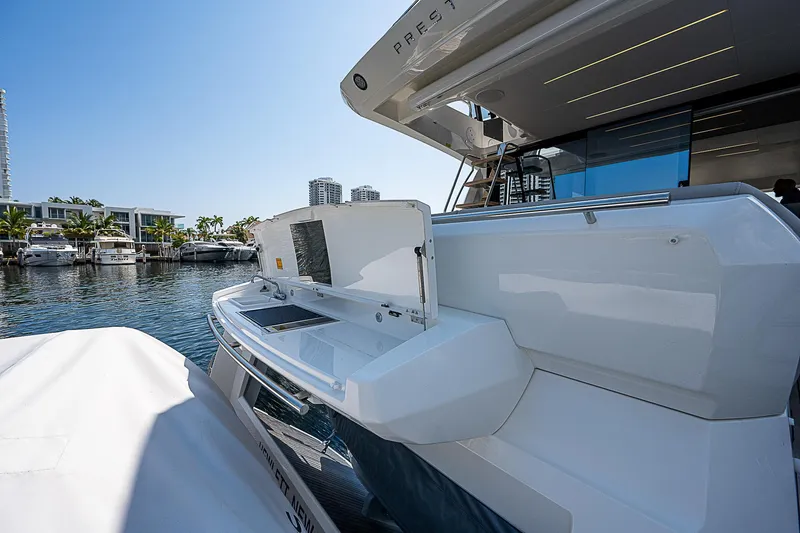 Slide: The Image of 2022 Prestige 520 Fly yacht docked at marina, showcasing sleek design and modern amenities. - 38