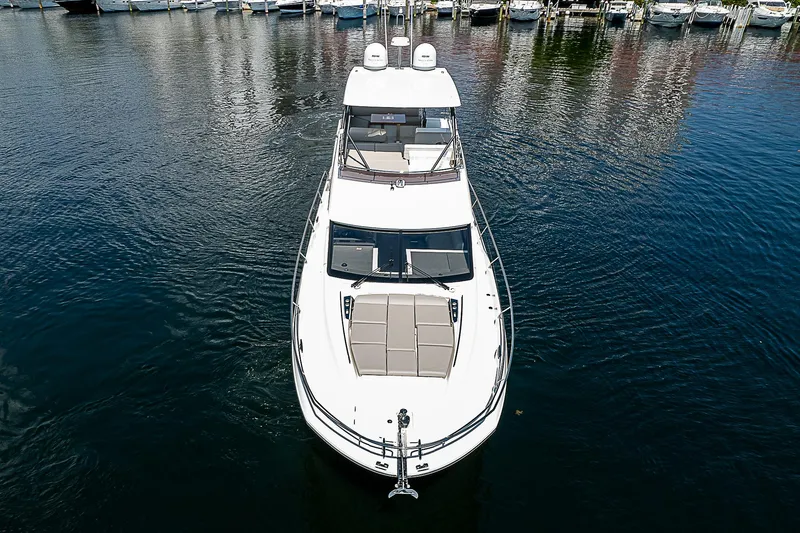 Slide: The Image of Prestige 520 Fly 2022 yacht on calm water, aerial view. - 5