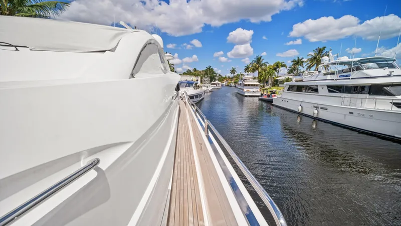 Slide: The Image of Side view of 2007 Sunseeker Predator 108 yacht docked in a marina. - 10