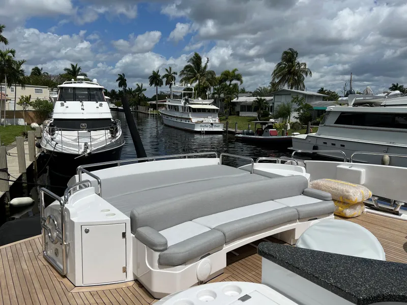 Slide: The Image of Sunseeker Predator 108 (2007) luxury yacht docked with spacious deck and seating area. - 13