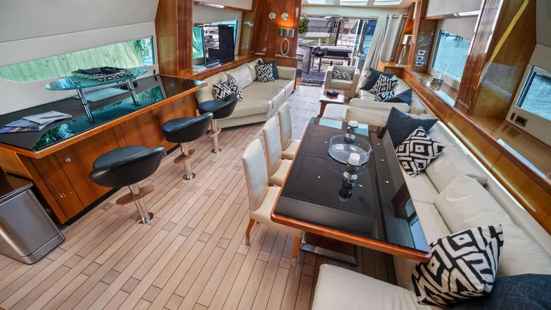 Slide: The Image of Luxurious interior of 2007 Sunseeker Predator 108 yacht with modern seating and dining area. - 25