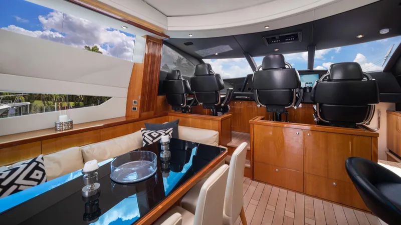 Slide: The Image of Luxurious interior of 2007 Sunseeker Predator 108 yacht with modern seating and dining area. - 28