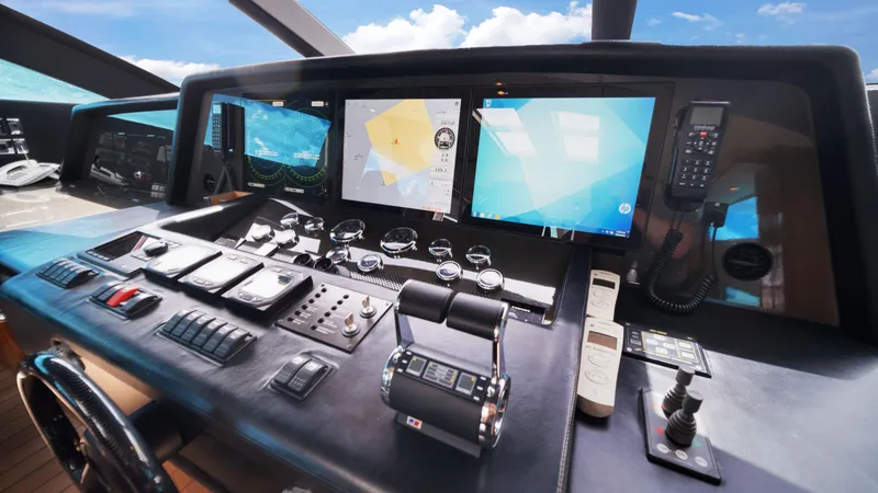 Slide: The Image of Cockpit of 2007 Sunseeker Predator 108 yacht with navigation screens and controls. - 32