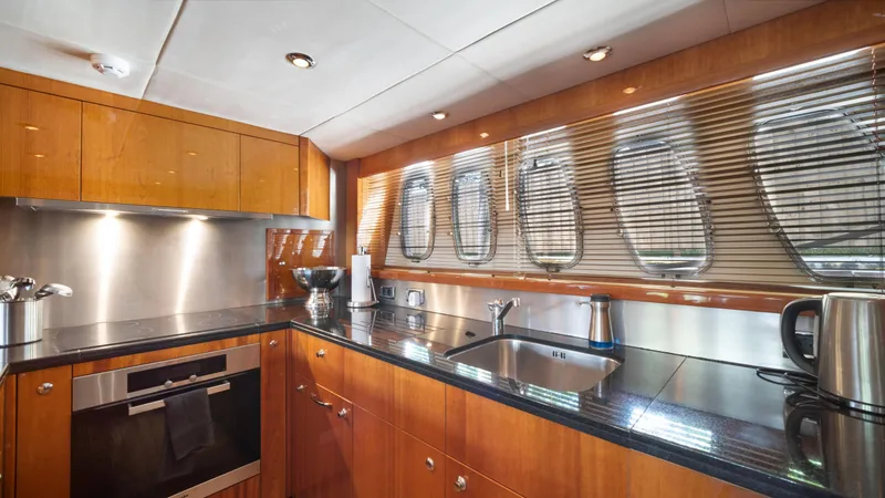 Slide: The Image of Luxurious kitchen interior of 2007 Sunseeker Predator 108 yacht with modern appliances. - 34