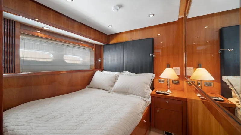 Slide: The Image of Luxurious bedroom interior of 2007 Sunseeker Predator 108 yacht with wooden finishes and cozy bedding. - 39