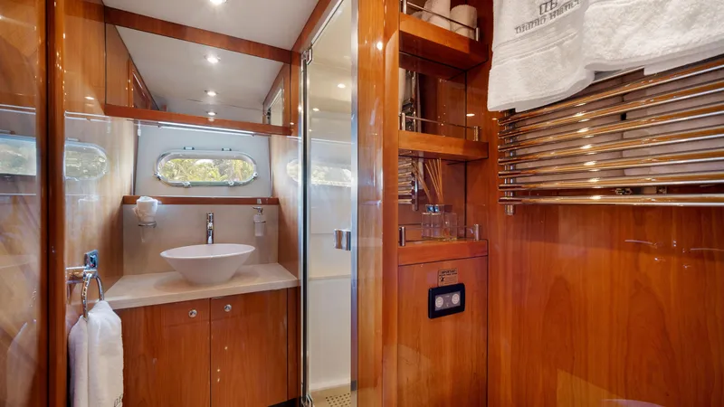 Slide: The Image of Luxurious bathroom in 2007 Sunseeker Predator 108 yacht with wooden cabinetry and modern fixtures. - 40