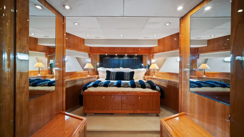 Slide: The Image of Luxurious master bedroom on 2007 Sunseeker Predator 108 yacht with wood paneling and elegant decor. - 42