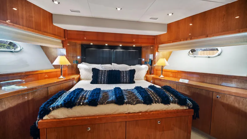 Slide: The Image of Luxurious bedroom interior of 2007 Sunseeker Predator 108 yacht with wooden finishes and cozy bedding. - 43