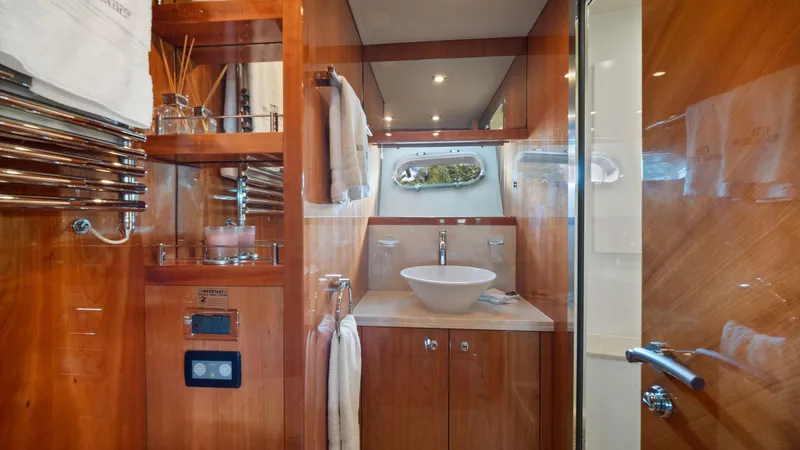 Slide: The Image of Luxurious bathroom in 2007 Sunseeker Predator 108 yacht with wooden cabinetry and modern fixtures. - 44