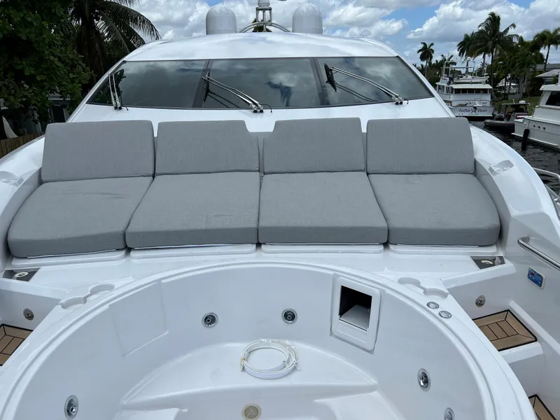 Slide: The Image of 2007 Sunseeker Predator 108 yacht with cushioned seating and jacuzzi on deck. - 8