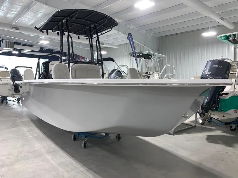 Slide: The Image of 2024 Savannah SS21 boat on display in a showroom. - 0