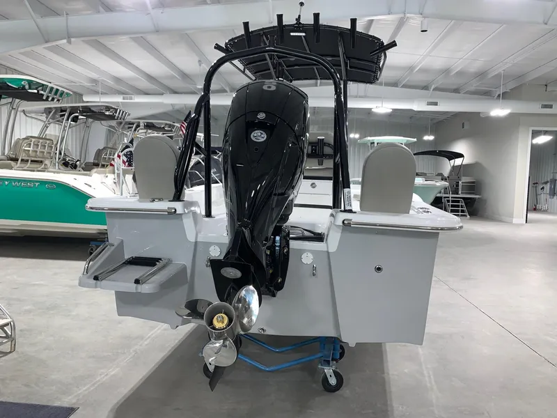 Slide: The Image of 2024 Savannah SS21 boat with outboard motor in showroom. - 1