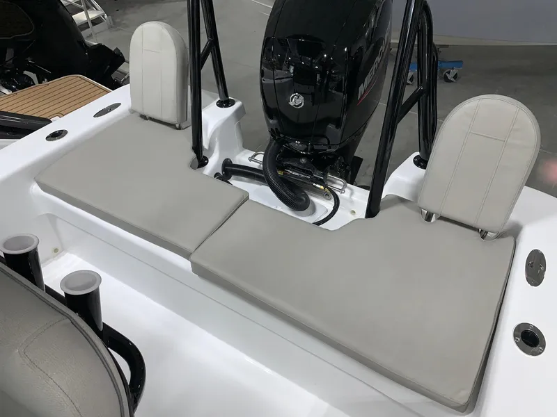 Slide: The Image of 2024 Savannah SS21 boat interior with cushioned seating and outboard motor. - 4