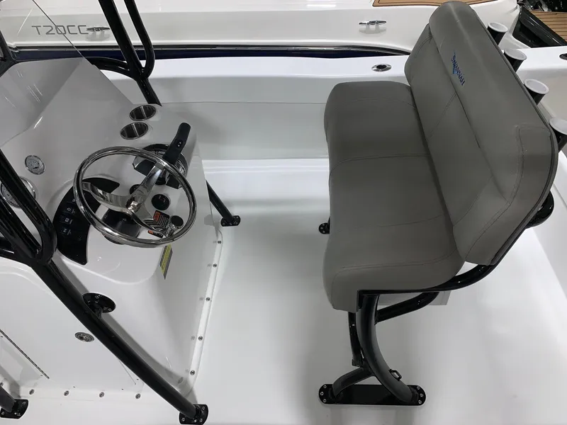Slide: The Image of 2024 Savannah SS21 boat interior with steering wheel and gray seating - 8