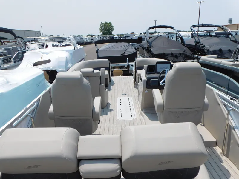 Slide: The Image of 2023 Silver Wave 2410 SW5 JS pontoon boat interior with beige seating. - 5