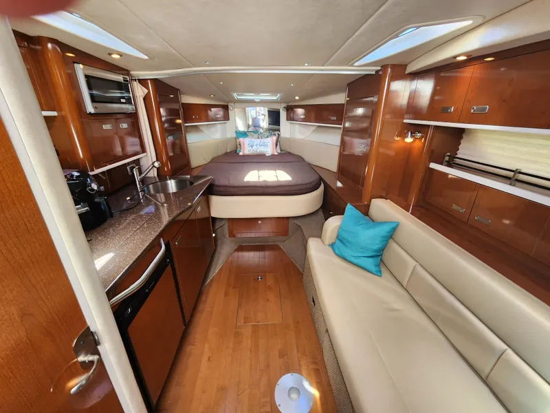Slide: The Image of Interior of 2012 Sea Ray 350 Sundancer yacht with cozy cabin and modern amenities. - 18
