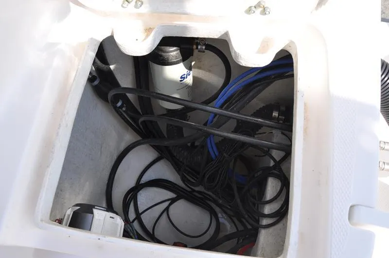 Slide: The Image of 2021 Century Coronado boat storage compartment with cables and equipment. - 10